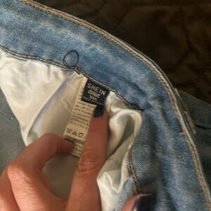 Light colored wrapped jeans